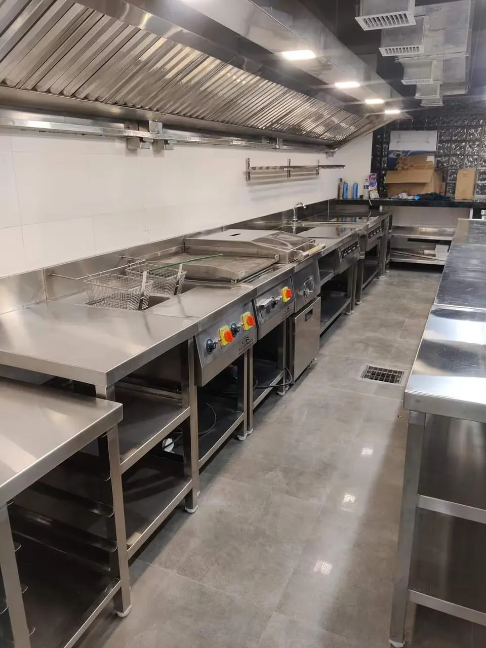 Custom commercial kitchen project with stainless steel counters in Bangalore